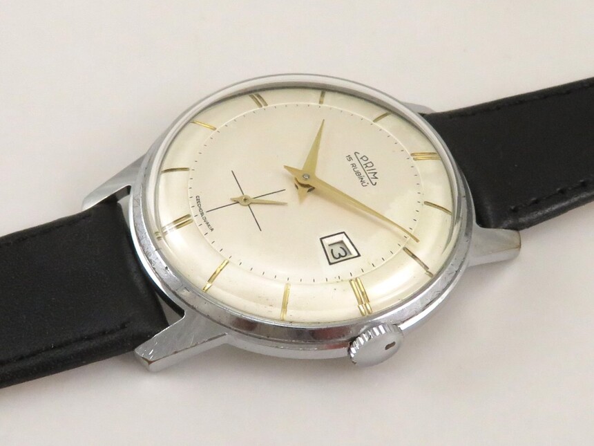 Hodinky PRIM Traktor (1960?) - obľúbené spoločenské hodinky, ktorých číselník pripomína pneumatiku traktora, zdroj: www.antik-hovorka.cz